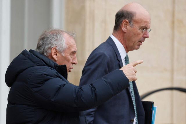 France's Prime Minister Francois Bayrou (L) and France's Minister for Economy, Finances and Industrial and Digital sovereignty Eric Lombard leave after the weekly cabinet meeting at the presidential Elysee Palace in Paris, on Janaury 15, 2025. (Photo by Ludovic MARIN / AFP)