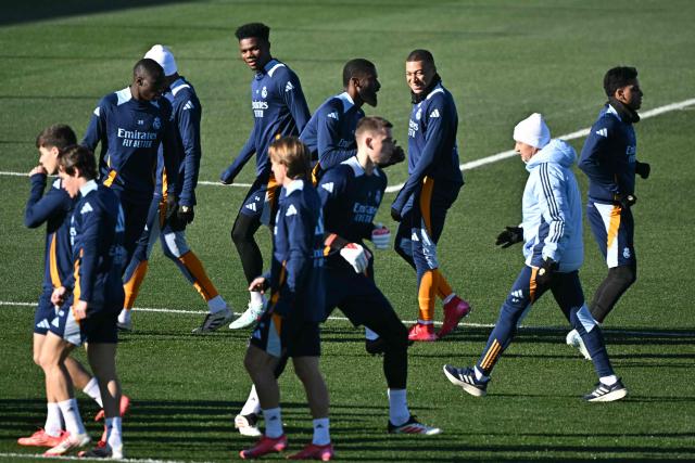 Real Madrid's French forward #09 Kylian Mbappe (3R) and teammates attend a training session at Real Madrid Sports City in Valdebebas, in the outskirts of Madrid, ahead of their King's Cup football match against Celta, on January 15, 2025. (Photo by JAVIER SORIANO / AFP)