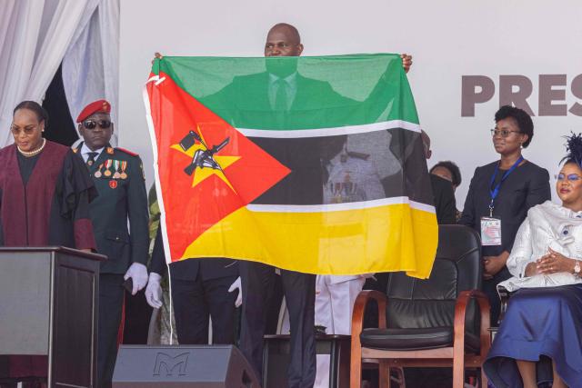 Daniel Chapo (C) holds a Mozambique national flag as he takes oath of office to be sworn in as the President of Mozambique during his inauguration at Independence Square in Maputo on January 15, 2025. Mozambique swore in Daniel Chapo as president on January 15, 2025 following months of post-election violence that an NGO says has killed more than 300 people.
Vowing "to devote all my energies to defending, promoting and consolidating national unity", Chapo, 48, extends his Frelimo party's 50-year rule of the gas-rich African nation. Opposition candidate Venancio Mondlane claims that the October 2024 election was rigged. (Photo by ALFREDO ZUNIGA / AFP)