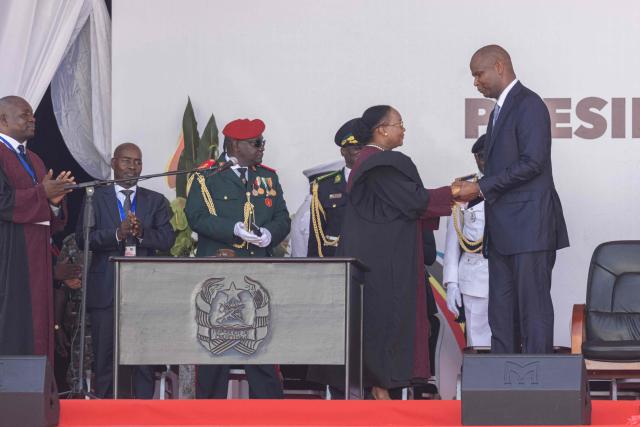 Daniel Chapo (R) is congratulated after taking oath of office to be sworn in as the President of Mozambique during his inauguration at Independence Square in Maputo on January 15, 2025. Mozambique swore in Daniel Chapo as president on January 15, 2025 following months of post-election violence that an NGO says has killed more than 300 people.
Vowing "to devote all my energies to defending, promoting and consolidating national unity", Chapo, 48, extends his Frelimo party's 50-year rule of the gas-rich African nation. Opposition candidate Venancio Mondlane claims that the October 2024 election was rigged. (Photo by ALFREDO ZUNIGA / AFP)