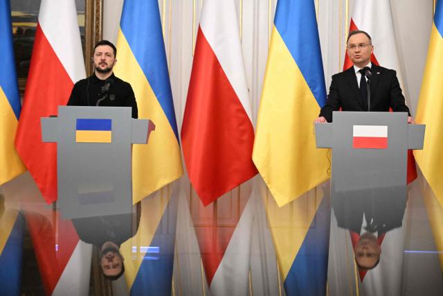 Polish President Andrzej Duda (R) and Ukraine's President Volodymyr Zelensky attend a joint press conference in Warsaw, Poland on January 15, 2025. (Photo by Sergei GAPON / AFP)