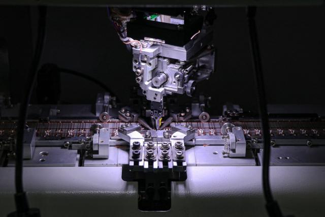 Semiconductor chips are seen under process at a factory in Binzhou, in eastern China's Shandong province on January 15, 2025. (Photo by AFP) / China OUT