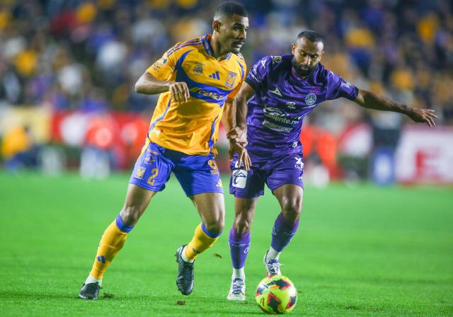 Tigres' Brazilian defender #02 Joaquim Henrique and Mazatlan's Ecuadorian midfielder #23 Jordan Sierra fight for the ball during the Liga MX Clausura football match between Tigres and Mazatlan at the Universitario (UANL) Stadium in San Nicolas de los Garza, Nuevo Leon State, Mexico on January 17, 2025. (Photo by Julio Cesar AGUILAR / AFP)