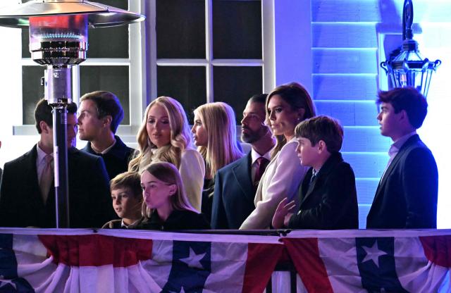 Michael Boulos (L), his wife Tiffany Trump (3L), Ivanka Trump (4L), her husband Jared Kushner (2L), Donald Trump Jr. (4R) and girlfriend Bettina Anderson (3R) get ready to watch fireworks during reception in honor US President-elect Donald Trump at Trump National Golf Club Washington DC in Sterling, Virginia, on January 18, 2025. (Photo by Jim WATSON / AFP)