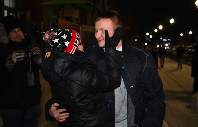 Gregory Purdy, a January 6 defendant, is hugged by a friend after his release from the DC Central Detention Facility where he was incarcerated for the 2021 attack on the Capitol, in Washington, DC, on January 21, 2025. On his first day in office, US President Donald Trump signed pardons for more than 1,500 people charged in the January 6, 2021 attack on the Capitol by his supporters trying to overturn the 2020 election. (Photo by ROBERTO SCHMIDT / AFP)