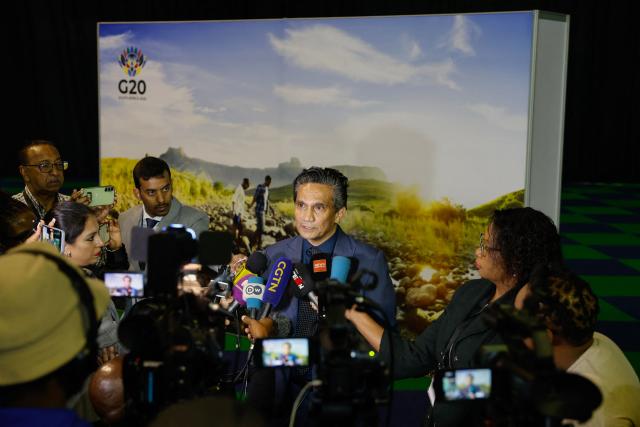 Director-General (DG) of the South African Department of International Relations and Cooperation (DIRCO) Zane Dangor (C) speaks to journalists ahead of the G20 Foreign Minister Meeting at the Nasrec Expo Centre in Johannesburg on February 20, 2025. Top diplomats from the Group of 20 major economies will convene in South Africa on February 20, 2025 for a meeting dominated by a packed global agenda but overshadowed by a snub by the top US envoy.
As a curtain-raiser to the G20 summit in November, the foreign ministers will gather for talks over two days, held for the first time in Africa. (Photo by PHILL MAGAKOE / AFP)