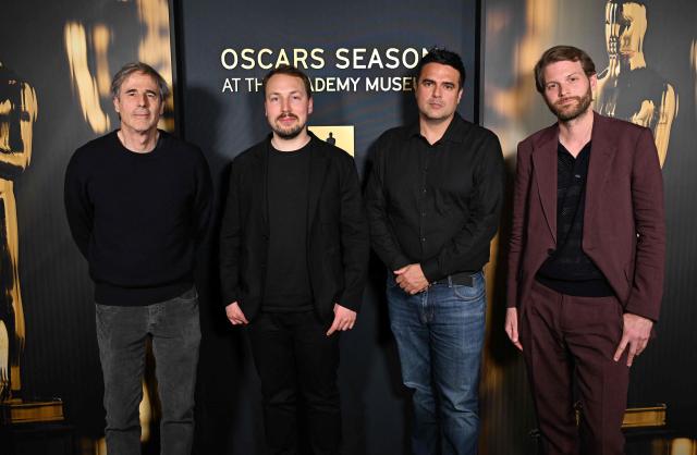 (L/R) Brazilian director Walter Salles, Latvian animator and director Gints Zilbalodis, producer Mani Tilgner and Swedish-Polish film director Magnus von Horn attend the Oscar Week: International Feature Film event at the Academy Museum of Motion Pictures in Los Angeles on February 28, 2025. (Photo by Robyn Beck / AFP)