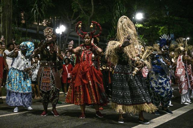 Members of the Ilu Oba de Min percussion perform during the street carnival in Sao Paulo, Brazil on February 28, 2025. Ilu Oba de Min known for embracing African and Afro-Brazilian culture, is one of the culturally-focused carnival street parties of Sao Paulo. (Photo by Nelson ALMEIDA / AFP)