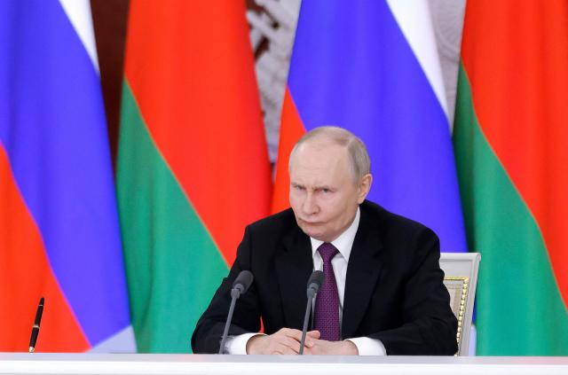 Russia's President Vladimir Putin reacts during a press conference following a meeting with his Belarusian counterpart at the Kremlin in Moscow on March 13, 2025. (Photo by Maxim Shemetov / POOL / AFP)