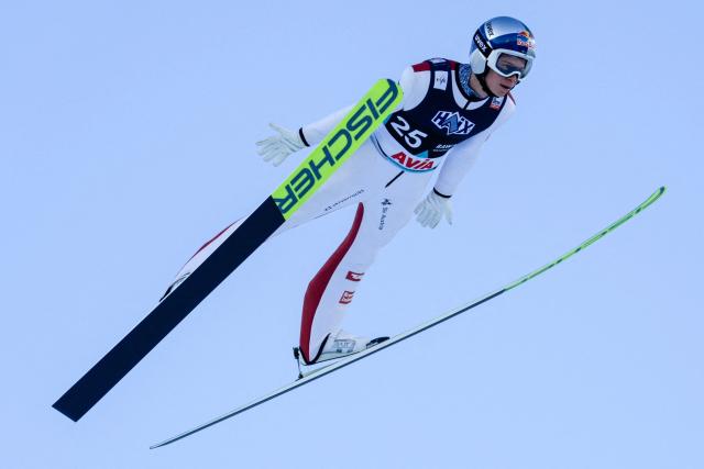 Austria's Stephan Embacher soars through the air during the first round of the men's individual HS134 event of the Raw Air FIS Ski Jumping World Cup in Holmenkollen, near Oslo on March 13, 2025. (Photo by Terje Bendiksby / NTB / AFP) / Norway OUT