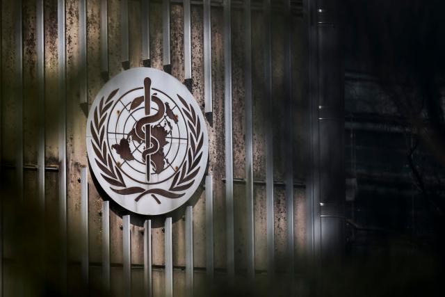 This photograph shows a sign of the World Health Organization (WHO) displayed at their headquarters on March 13, 2025. The Swiss government is not doing enough to defend Geneva-based international organisations and NGOs whose operations are threatened by US President Donald Trump's decision to cut foreign aid, Nathalie Fontanet, President of Switzerland's Geneva canton told Le Temps newspaper on March 10, 2025. (Photo by Fabrice COFFRINI / AFP)