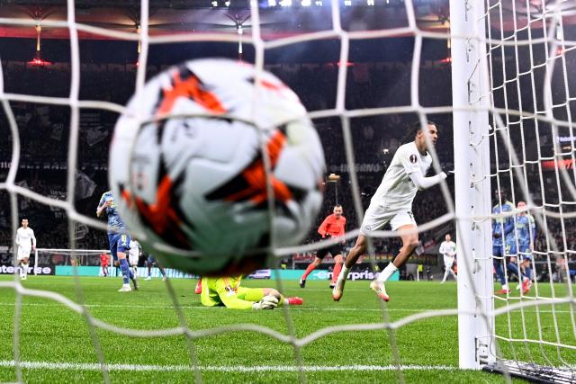 Frankfurt's French forward #19 Jean-Matteo Bahoya celebrates scoring the 1-0 goal during the UEFA Europa League round of 16 second leg football match between Eintracht Frankfurt and AFC Ajax Amsterdam in Frankfurt am Main, western Germany on March 13, 2025. (Photo by Kirill KUDRYAVTSEV / AFP)