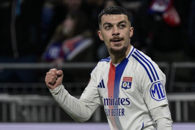 Lyon’s Georgian forward #69 Georges Mikautadze celebrates after scoring his team's first goal during the second leg last 16 UEFA Europa League football match between Olympique Lyonnais (OL) (FRA) and Steaua Bucharest FCSB (ROM) at The Groupama Stadium in Decines-Charpieu, south-eastern France on March 13, 2025. (Photo by JEAN-PHILIPPE KSIAZEK / AFP)