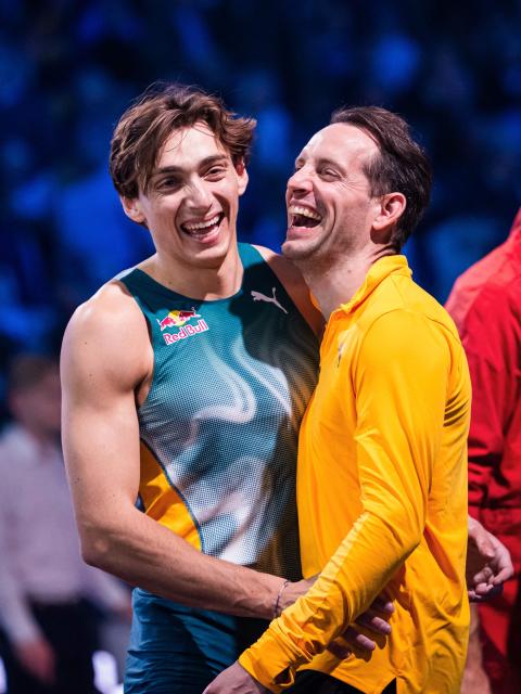 Sweden’s Armand Duplantis (L) shares a moment with France’s Renaud Lavillenie during the Mondo Classics 2025 Athletics Meeting at the IFU Arena in Uppsala, Sweden on March 13, 2025. (Photo by Jonathan NACKSTRAND / AFP)