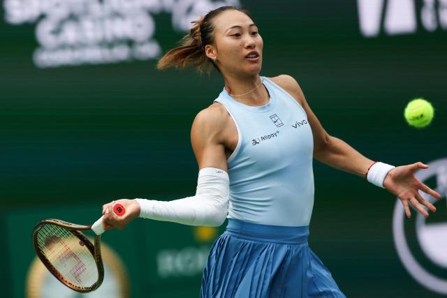 China’s Qinwen Zheng returns the ball to Poland’s Iga Swiatek during the women’s singles quarter-final tennis match at the BNP Paribas Open at the Indian Wells Tennis Garden in Indian Wells, California, on March 13, 2025. (Photo by Patrick T. Fallon / AFP)