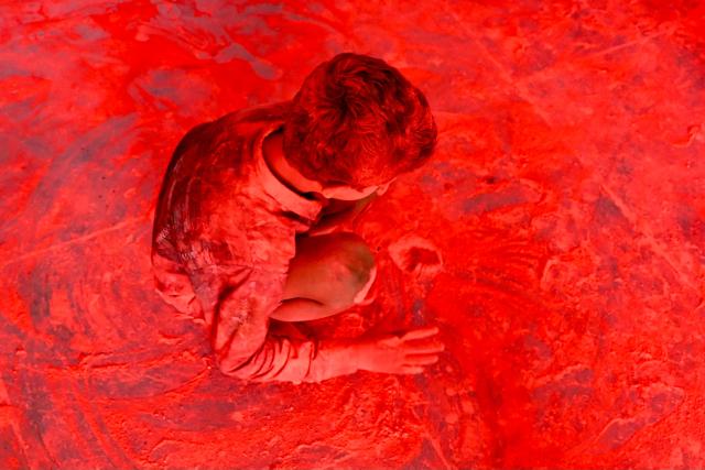 A visually impaired child celebrates Holi, the Hindu spring festival of colours, at a school for the blind in Hyderabad on March 14, 2025. (Photo by NOAH SEELAM / AFP)