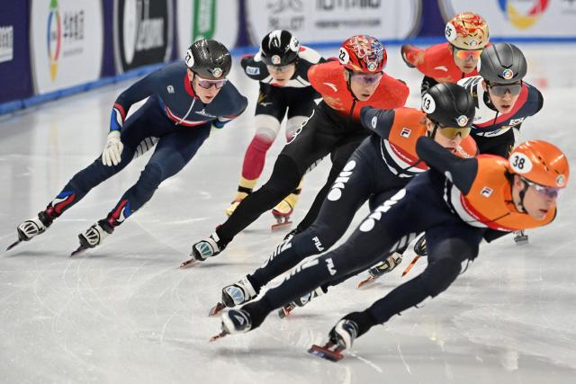 Netherland’s Jens Van ‘T Wout (13) and Daan Kos (38), Britain’s Niall Treacy (27) and China’s Sun Long compete in the men’s 1500 meter semifinals at the 2025 ISU World Short Track Championships in Beijing on March 15, 2025. (Photo by ADEK BERRY / AFP)