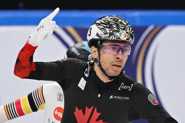 Canada’s William Dandjinou celebrates after winning the men’s 1500 meter final at the ISU World Short Track Championships in Beijing on March 15, 2025. (Photo by GREG BAKER / AFP)