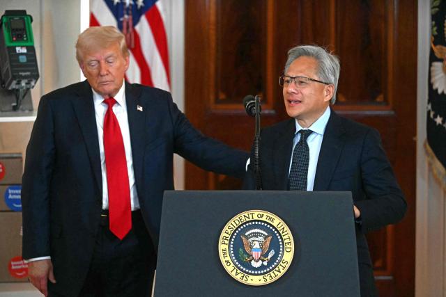 Nvidia CEO Jensen Huang (R) speaks alongside US President Donald Trump speaks about investing in America, at the White House in Washington, DC, on April 30, 2025. (Photo by Jim WATSON / AFP)