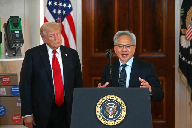 Nvidia CEO Jensen Huang (R) speaks alongside US President Donald Trump speaks about investing in America, at the White House in Washington, DC, on April 30, 2025. (Photo by Jim WATSON / AFP)