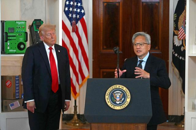Nvidia CEO Jensen Huang (R) speaks alongside US President Donald Trump speaks about investing in America, at the White House in Washington, DC, on April 30, 2025. (Photo by Jim WATSON / AFP)