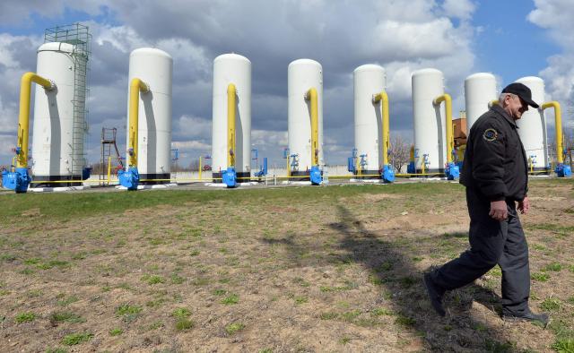 (FILES) An employee walks past a gas installation during a training exercise for handling emergencies at a gas-pumping station on the gas pipeline in the small town Boyarka on April 22, 2015 in the Kiev region. The oil and gas market of Ukraine has about 500 companies and enterprises of different ownership. AFP PHOTO / GENYA SAVILOV. The United States and Ukraine on April 30, 2025 signed a minerals deal after a two-month delay, in what President Donald Trump's administration called a new form of US commitment to Kyiv after the end of military aid. Ukraine said it secured key interests after protracted negotiations, including full sovereignty over its own rare earths, which are vital for new technologies and largely untapped. (Photo by GENYA SAVILOV / AFP)