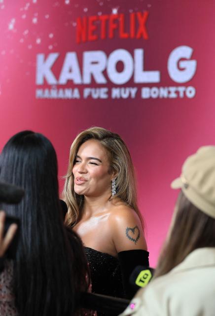 Colombian singer Karol G (C) gestures during the launch of her documentary "Mañana Fue Muy Bonito" (Tomorrow Was Very Nice) in Medellin, Colombia, on April 30, 2025. The documentary will be broadcast on the streaming platform Netflix on May 8, 2025. (Photo by JAIME SALDARRIAGA / AFP)