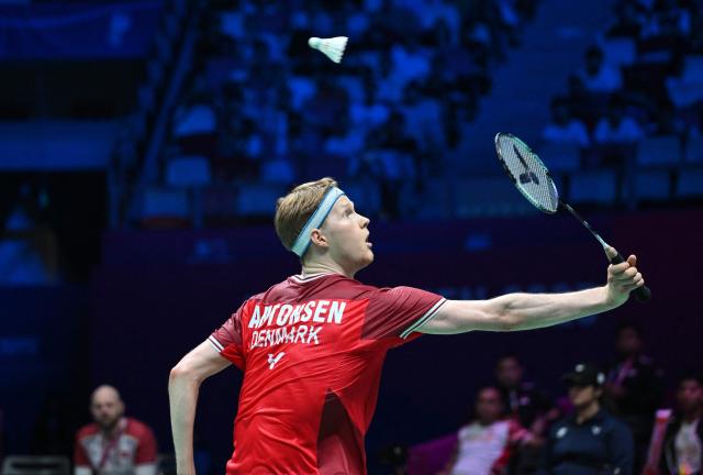 Denmark’s Anders Antonsen hits a return to Indonesia’s Alwi Farhan during their men’s singles match at the Sudirman Cup badminton championship in Xiamen, China’s southeastern province on May 1, 2025. (Photo by ADEK BERRY / AFP)