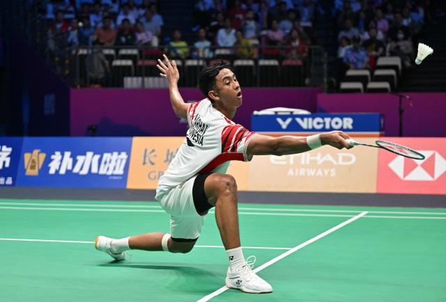 Indonesia’s Alwi Farhan hits a return to Denmark’s Anders Antonsen during their men’s singles match at the Sudirman Cup badminton championship in Xiamen, China’s southeastern province on May 1, 2025. (Photo by ADEK BERRY / AFP)