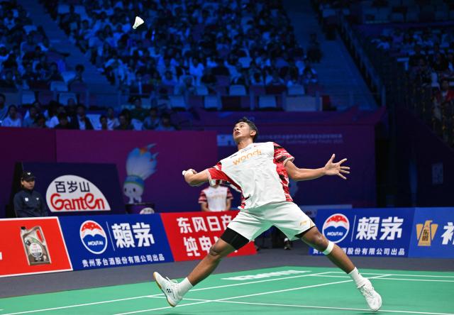 Indonesia’s Alwi Farhan hits a return to Denmark’s Anders Antonsen during their men’s singles match at the Sudirman Cup badminton championship in Xiamen, China’s southeastern province on May 1, 2025. (Photo by ADEK BERRY / AFP)