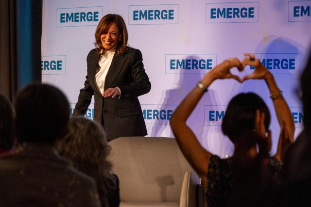 An attendee makes the sign of a heart with their hands as former US Vice President Kamala Harris leaves after speaking at the Emerge 20th Anniversary Gala in San Francisco, California, on April 30, 2025. (Photo by Camille Cohen / AFP)
