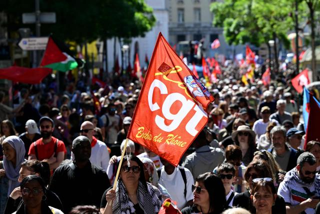 A protester holds a flag of General Confederation of Labour (CGT) union during a May Day (Labour Day) rally, marking International Workers' Day, in Marseille, south of France, on May 1, 2025. (Photo by Miguel MEDINA / AFP)