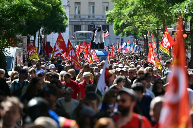 Protesters hold flags of General Confederation of Labour (CGT) union during a May Day (Labour Day) rally, marking International Workers' Day, in Marseille, south of France, on May 1, 2025. (Photo by Miguel MEDINA / AFP)