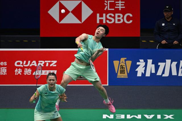 Australia’s Ricky Tang (back) and Groya Somerville play a point against France’s Gregoire Deschamp and Margot Lambert during their mixed doubles match at the Sudirman Cup badminton championship in Xiamen, China’s southeastern Fujian province on May 1, 2025. (Photo by ADEK BERRY / AFP)