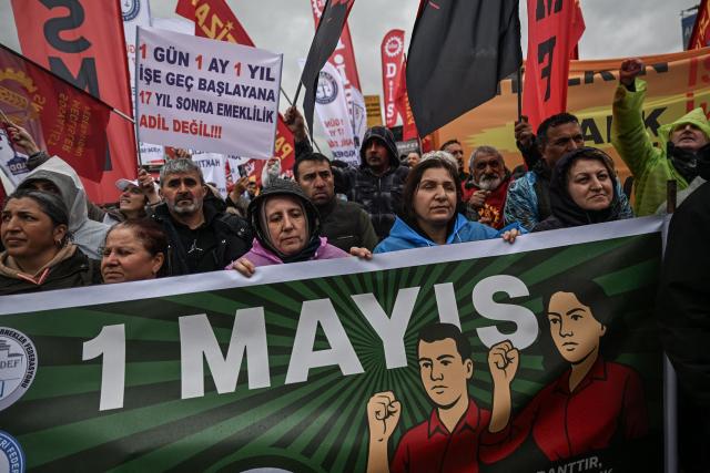 Demostrators shout slogans during a May Day (Labour Day) rally, marking International Workers' Day, in the Kadikoy district of Istanbul, on May 1, 2025. Turkish police on May 1, 2024, detained dozens of protesters attempting to tear down barricades in different districts of Istanbul after authorities banned May 1 rallies at the city's main Taksim Square. (Photo by Ozan KOSE / AFP)