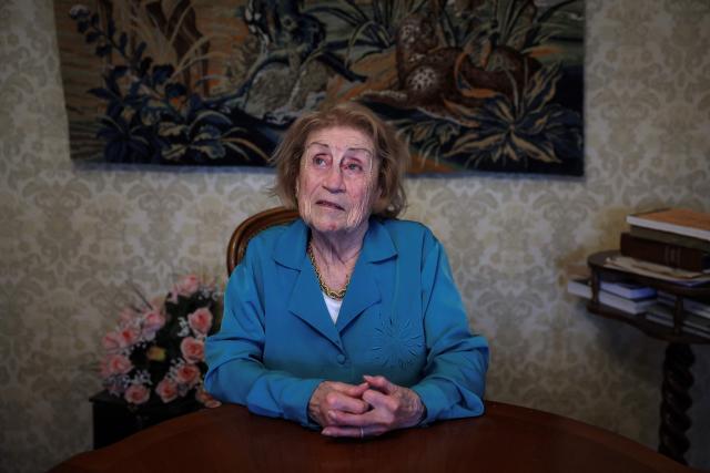 (FILES) French author Marie Vaislic, who was deported to a concentration camp in Germany during the World War ll at the age of 14, poses for a photo at her home in Toulouse, southwestern France, on February 21, 2024. Marie Vaislic, a Holocaust survivor who fought to ensure that the horror of the Holocaust would never be forgotten, died on May 1, 2025 in Toulouse at the age of 94, her son Claude Vaislic told AFP, confirming a report in the magazine Le Point. (Photo by Valentine CHAPUIS / AFP)