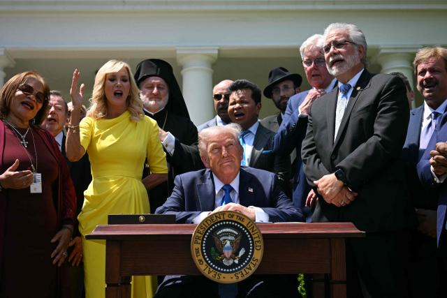 Pastor Paula White (2nd L) and other faith leaders paray behind US President Donald Trump during a National Day of Prayer event in the Rose Garden of the White House in Washington, DC, on May 1, 2025. (Photo by Jim WATSON / AFP)