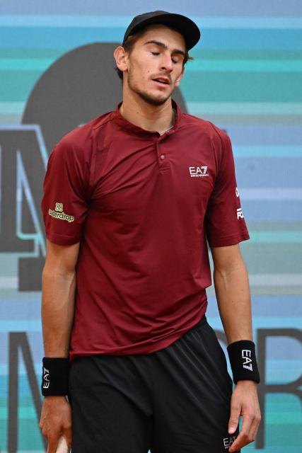 Italy's Matteo Arnaldi reacts after losing a point against Great Britain's Jack Draper during their 2025 ATP Tour Madrid Open tennis tournament quarter-final singles match at the Caja Magica in Madrid, on May 1, 2025. (Photo by JAVIER SORIANO / AFP)