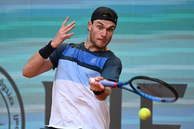 Great Britain's Jack Draper returns the ball to Italy's Matteo Arnaldi during their 2025 ATP Tour Madrid Open tennis tournament quarter-final singles match at the Caja Magica in Madrid, on May 1, 2025. (Photo by JAVIER SORIANO / AFP)