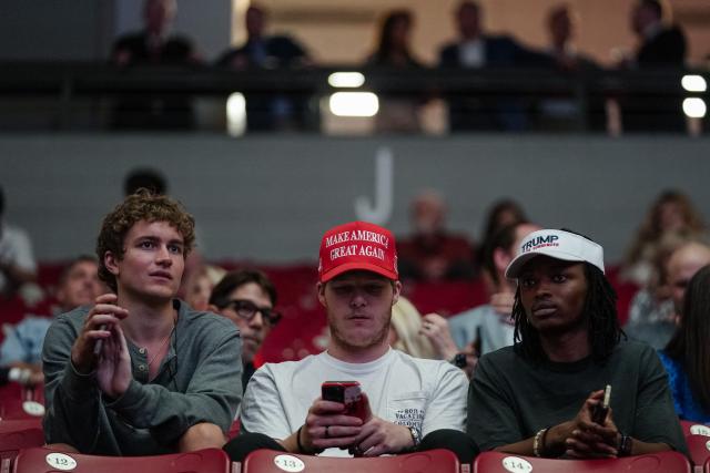 Attendees wearing MAGA hats sit inside Coleman Coliseum before US President Donald Trump delivers commencement remarks at the University of Alabama in Tuscaloosa, Alabama, on May 1, 2025. (Photo by Elijah Nouvelage / AFP)