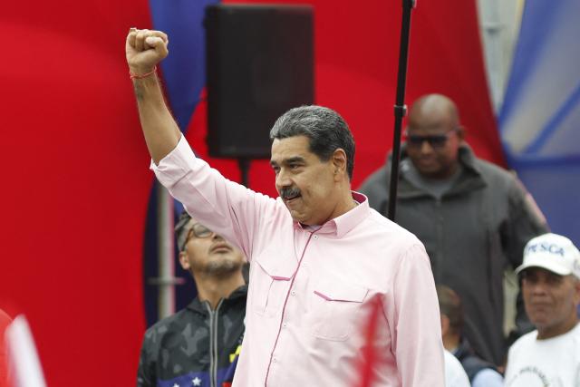 Venezuela's President Nicolas Maduro gestures during a march to commemorate May Day (Labour Day), marking International Workers' Day in Caracas on May 1, 2025. (Photo by Pedro MATTEY / AFP)
