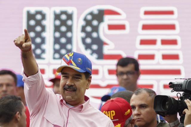 Venezuela's President Nicolas Maduro gestures during a march to commemorate May Day (Labour Day), marking International Workers' Day in Caracas on May 1, 2025. (Photo by Pedro MATTEY / AFP)