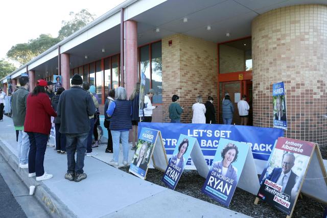 Voters wait to cast their ballots in Australia’s general election at a polling station in Melbourne on May 3, 2025. (Photo by Martin KEEP / AFP)
