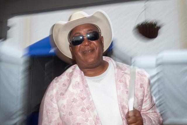 An attendee sports a floral suit on Oaks Day ahead of the 151th running of the Kentucky Derby at Churchill Downs on May 2, 2025, in Louisville, Kentucky. (Photo by LEANDRO LOZADA / AFP)