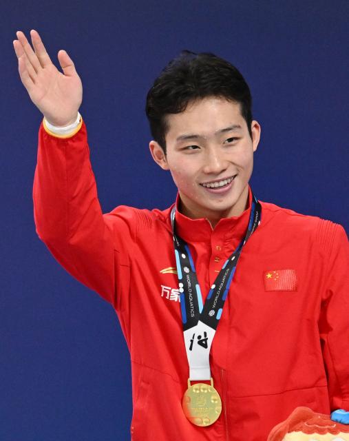 China’s Wang Zongyuan celebrates on the podium after winning the men’s 3 meter springboard event at the World Aquatics Diving World Cup Super Final, in the Water Cube in Beijing on May 3, 2025. (Photo by GREG BAKER / AFP)