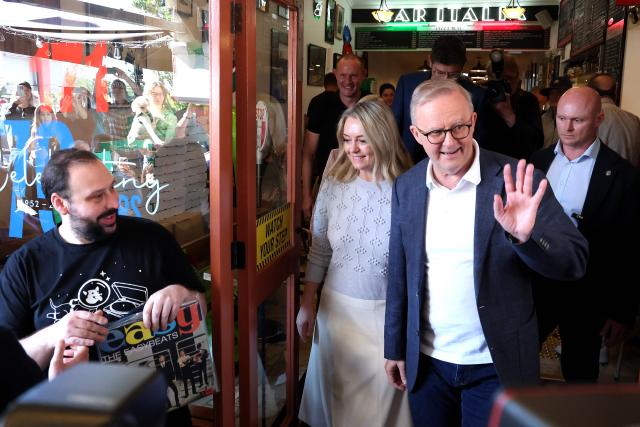 Australia's re-elected Prime Minister Anthony Albanese leaves after a visit to a cafe in Sydney on May 4, 2025, following his party’s decisive federal election victory. (Photo by DAVID GRAY / AFP)