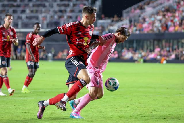 Inter Miami's Argentine forward #10 Lionel Messi fights for the ball with the New York Red Bulls' Swedish defender #03 Noah Eile during the MLS football match between Inter Miami FC and the New York Red Bulls, at Chase Stadium in Fort Lauderdale, Florida on May 3, 2025. (Photo by Chris Arjoon / AFP)