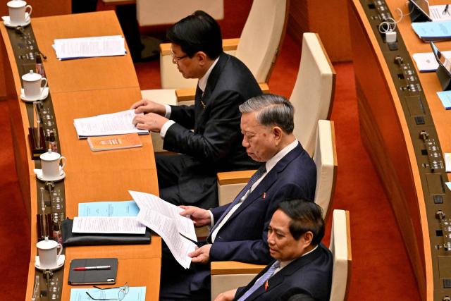 (L-R) Vietnam's President Luong Cuong, Vietnam's General Secretary of the Communist Party To Lam and Vietnam's Prime Minister Pham Minh Chinh attend the National Assembly's summer session opening in Hanoi on May 5, 2025. (Photo by Nhac NGUYEN / AFP)
