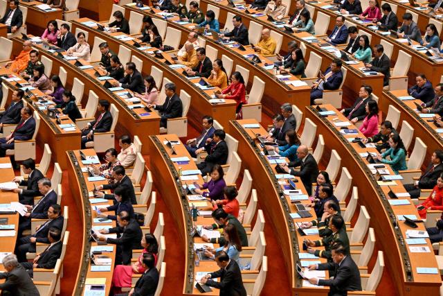 Vietnam's members of parliament attend the National Assembly's summer session opening in Hanoi on May 5, 2025. (Photo by Nhac NGUYEN / AFP)