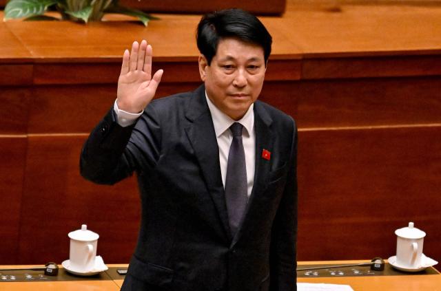 Vietnam's President Luong Cuong waves as he attends the National Assembly's summer session opening in Hanoi on May 5, 2025. (Photo by Nhac NGUYEN / AFP)